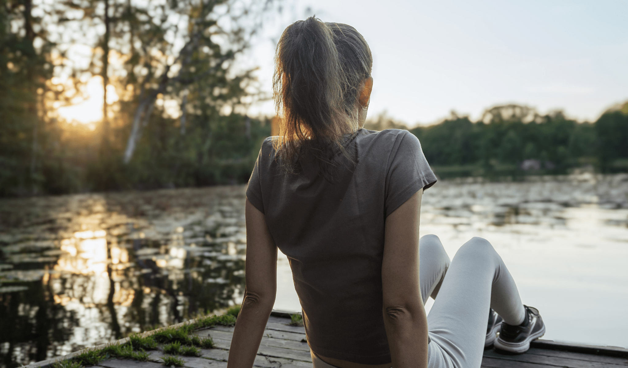 woman relaxing on dock